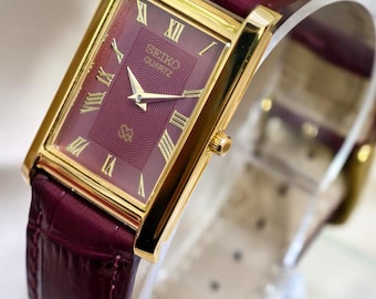 Zegarek Vintage Seiko Tank, tarcza bordowa, koperta w kolorze złotym