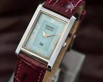 Vintage Seiko Slim rectangular Quartz watch with elegant Roman numeral Blue dial style for everyday or formal wear.