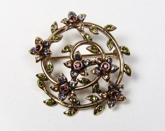 Vintage Signed Monet Gold Tone Green Purple Rhinestone Swirl Floral Brooch Pin