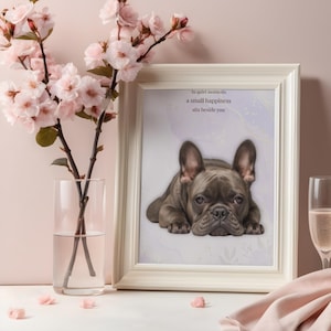 May include: A framed print of a grey French Bulldog lying down, with the text "In quiet moments a small happiness sits beside you." The print is in a white frame, next to a vase of pink flowers.