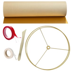 May include: A roll of tan paper, red double-sided tape, white tape, a wooden tool, and a gold-colored lampshade frame are displayed against a white background. The lampshade frame is circular with three supporting rods.