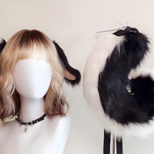 以下が含まれることがあります： クリーム色、ライトグレー、ダークグレーの3色の、まだら模様のマット仕上げのセラミックマグのセット。各マグはシンプルでミニマルなデザインで、丸みを帯びたハンドルが付いています。