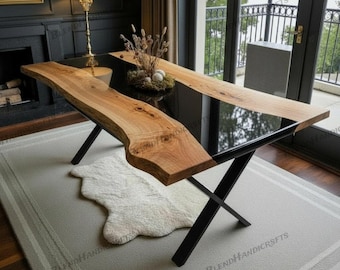 May include: A modern live edge dining table with a black epoxy resin center. The table features natural wood edges and black metal legs. The table is approximately 183 cm long and 91 cm wide.
