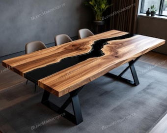 May include: A rectangular wooden dining table with a black epoxy river design. The table has a natural wood grain finish and sits on black metal cross-shaped legs. The table is approximately 183 cm long.