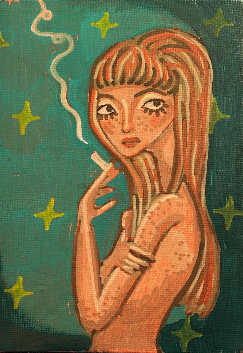 May include: An original painting of a woman with long red hair and freckles, holding a cigarette. The background is teal with yellow star accents. The woman is painted in a vintage style.