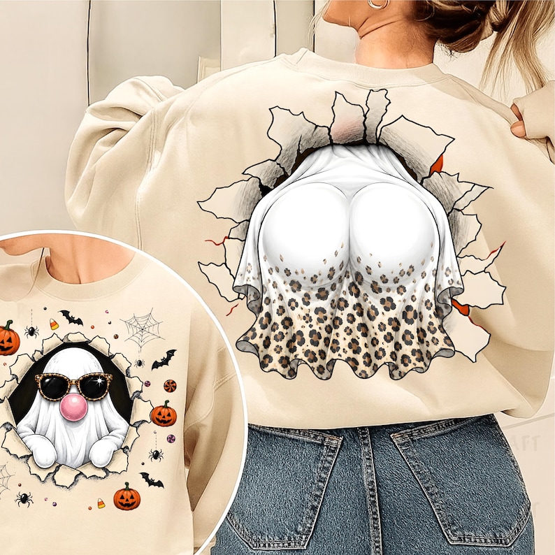 May include: A beige sweatshirt featuring a graphic of a ghost wearing sunglasses and blowing a pink bubble gum bubble, surrounded by pumpkins, spiders, and webs. The back design shows a ghost with a leopard print skirt emerging from a tear.