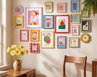 May include: A gallery wall featuring a collection of various colorful picture frames with scalloped, beaded, and smooth edges. The frames contain diverse illustrations including a watermelon labeled Melone, a matcha latte, and a coffee cup.