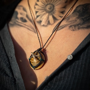 Macrame necklace with shell and starfish pendant