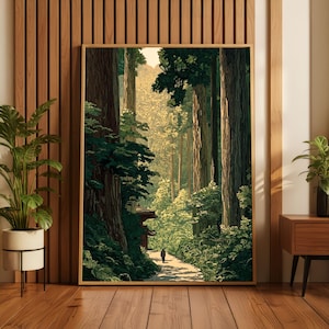 May include: A framed art print depicting a serene forest scene. The artwork features tall trees, a pathway, and a distant figure, rendered in shades of green, brown, and gold. The print is displayed in a wooden frame, adding a natural touch to the decor.