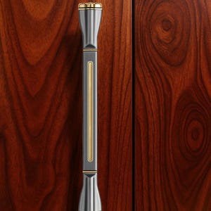 May include: A vertical cabinet pull with a dark grey body and gold accents. The handle has a rectangular centre with a gold stripe and flared ends with gold trim. The background is a rich, dark wood grain.