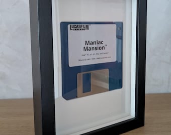 Moldura para disquete - Maniac Mansion - 1987 - Disquete emoldurado
