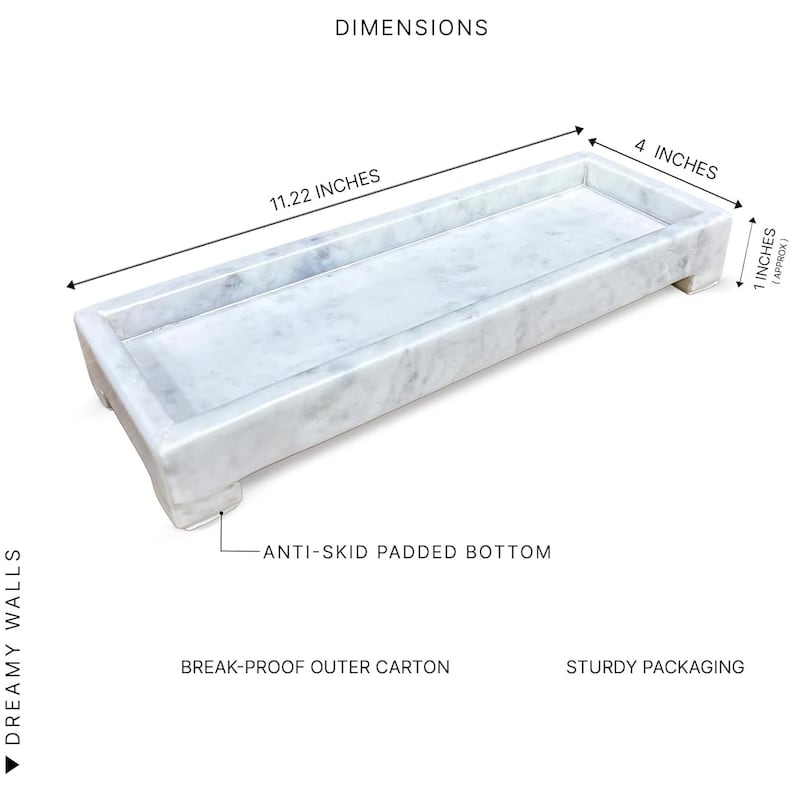 May include: A rectangular marble tray with a light grey and white veined pattern. The tray is 28.5 cm long, 10.2 cm wide, and approximately 2.5 cm high. It has an anti-skid padded bottom. The text "DIMENSIONS" is visible.