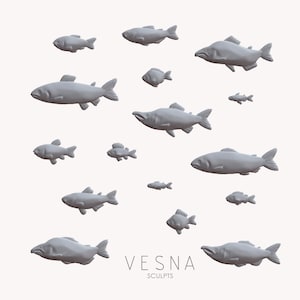 May include: A collection of gray fish sculptures of varying sizes, arranged against a neutral background. The sculptures are detailed, with fins and scales visible. The text "VESNA SCULPTS" is at the bottom.