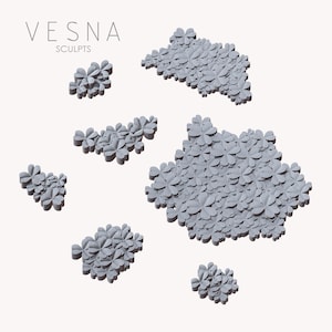 Può includere: Sculture grigie a forma di trifoglio disposte in varie dimensioni e forme. La parola "VESNA" è sopra "SCULPTS" in testo grigio. Le sculture sono su sfondo bianco.