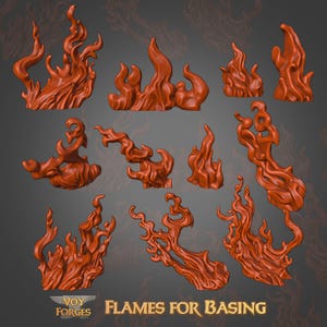 Peut inclure: Plusieurs flammes orange-rouge stylisées de différentes formes. Elles sont conçues pour le modélisme, avec le logo "Voy Forges" et le texte "Flames for Basing" en bas de l'image.