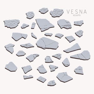 May include: An arrangement of light grey, irregularly shaped sculptures with dark brown edges, resembling broken pieces. The word "VESNA" and the word "SCULPTS" are printed in a light grey colour on the upper right side of the image.