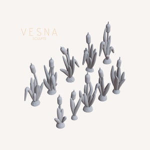 May include: A collection of gray, stylized cattail sculptures. Each sculpture features a cylindrical head atop a stalk with long, slender leaves. The sculptures are arranged on a light background. The text "VESNA SCULPTS" is in the upper left corner.