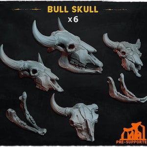 May include: A set of six gray resin bull skull miniatures, including three complete skulls with horns and three separate lower jawbones. The text BULL SKULL x6 and PRE-SUPPORTED is visible on the dark background, indicating these are 3D printed models.