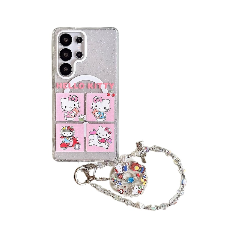Peut inclure: Une coque de t&eacute;l&eacute;phone transparente avec un motif Hello Kitty. L'&eacute;tui pr&eacute;sente quatre carr&eacute;s roses avec diff&eacute;rentes illustrations de Hello Kitty. Une cha&icirc;ne argent&eacute;e avec des perles et des breloques est attach&eacute;e &agrave; l'&eacute;tui.