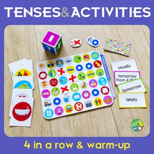 May include: An educational game set with the text "TENSES & ACTIVITIES" and "4 in a row & warm-up". The set includes cards, a game board with icons, a die, and tokens. The game is designed for language learning.