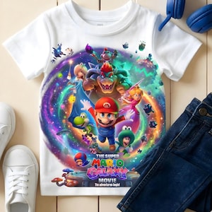 May include: A white ceramic mug with a black handle and the text "But First, Coffee" in a black, bold font. The mug is on a white surface.