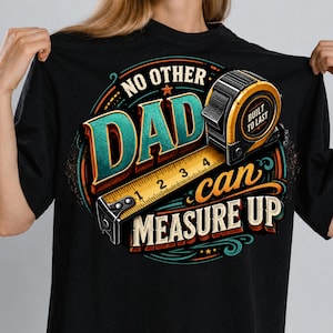 May include: Black t-shirt with a colourful graphic design. The design features the text "NO OTHER DAD" in teal and gold, along with a measuring tape and tape measure. The text "can MEASURE UP" is also included.