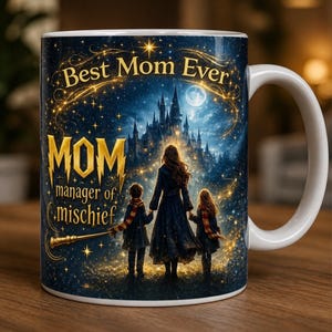 May include: White ceramic mug with a wraparound design featuring a starry night scene, a castle, and a mother with two children. The mug has the text "Best Mom Ever" and "MOM manager of mischief".