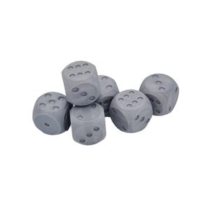 May include: A cluster of six light gray six-sided dice. Each die features rounded corners and circular indentations representing the numbers one through six. The dice are arranged in a small pile, showing various numerical faces on each cube.