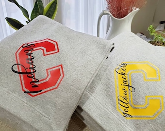 Cozy sweatshirt blankets customized for your favorite school or team!