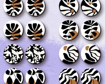 May include: Twelve round wooden charms with black and white abstract floral designs. Each charm features a brown accent. The charms are arranged in four rows of three. The text "HALOCOLOR Professional Laser Cut Wood Charm" is at the top of the image. The text "www.halocolor.etsy.com" is at the bottom of the image.