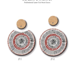May include: Two wooden earrings with a circular design featuring black lines, red dots, and a central pattern. The earrings are labelled #1 and #2. Each earring has a small, round wooden piece at the top. The text "HALOCOLOR" is at the top.