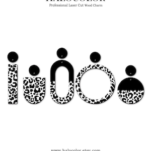May include: Black and white laser-cut wood charms in various shapes, including a rectangle, a half-circle, a U-shape, a circle, and a half-circle. The charms feature a leopard print pattern and are topped with a small black circle. The text "HALOCOLOR" and "Professional Laser Cut Wood Charm" are at the top.