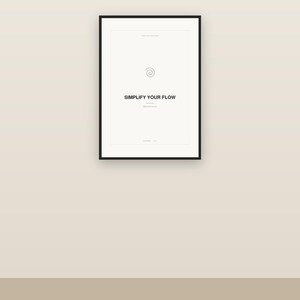May include: A rectangular wall art print in a thin black frame featuring a white background with a small spiral icon centered at the top and the text SIMPLIFY YOUR FLOW printed in bold black capital letters in the center of the composition.