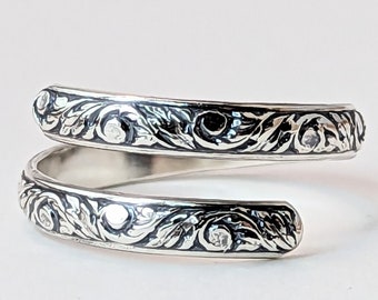 Adjustable sterling silver detailed scrollwork band, bypass wrap ring