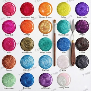 May include: A selection of 20 shimmering paint colours in various shades, including red, orange, yellow, green, blue, and purple, plus metallic hues. A paintbrush and palette knife are also shown.