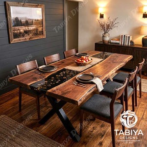 May include: A live edge wood dining table with a central black resin river inlay filled with smooth river stones. The table features a black metal X-frame base and is surrounded by six wooden chairs with dark grey upholstered seats.