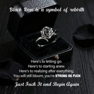 May include: A silver ring with a black rose design, displayed in an open black jewelry box. The text "Black Rose is a symbol of rebirth" is above the ring. Additional text includes inspirational phrases.
