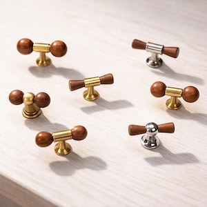 May include: A set of three ceramic mugs with a speckled, matte finish. Each mug features a different color: light blue, cream, and gray. The mugs have a simple, modern design and a comfortable handle.