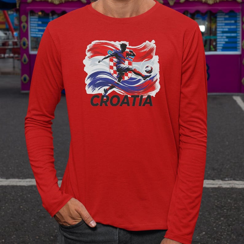 A red long-sleeved shirt with a graphic of a soccer player kicking a ball, along with the word "Croatia" printed on it.