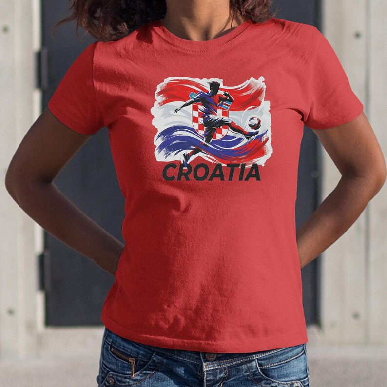 A red t-shirt with a graphic of a soccer player kicking a ball, along with the word "Croatia" printed on it.