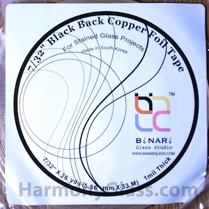May include: A roll of 7/32" Black Back Copper Foil Tape for stained glass projects. The label is white with black text and a circular design. The tape is 36 yards long and 1 mil thick. Made in South Korea.