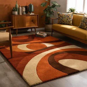 May include: A retro-style area rug with a swirling pattern in shades of orange, brown, and cream. The rug features a textured surface and adds a warm, inviting feel to the room. The design is reminiscent of the 1970s.