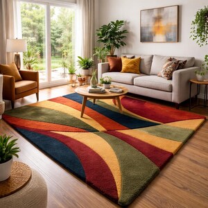 May include: A vibrant area rug with a geometric pattern. The rug showcases curved stripes in blue, green, orange, red, and yellow. The rug is in a living room with a sofa, armchair, and coffee table.