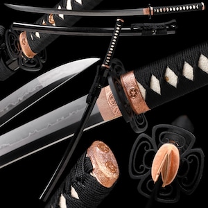 May include: A Japanese katana sword with a black handle wrapped in a diamond pattern, a black scabbard, and a silver blade. The sword features copper-colored accents and a decorative guard. The overall design is sleek and traditional.