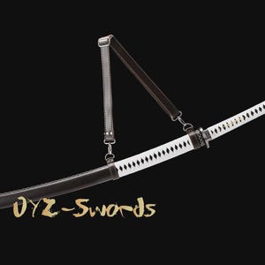 May include: A Japanese katana sword with a white blade and black scabbard. The sword has a leather strap and is set against a black background. The text "OYZ-Swords" is in gold script.