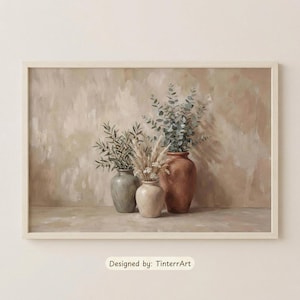 May include: A framed art print featuring three vases with botanical arrangements. The vases are in shades of brown, gray, and cream, filled with eucalyptus, wheat, and olive branches. The background is a neutral, textured wall. Text: Designed by: TinterrArt.