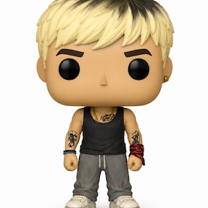 May include: A stylised vinyl collectible figure featuring a character with blonde hair with dark roots, wearing a black tank top, grey sweatpants, and white trainers. The figure has visible arm tattoos, a gold chain, a blue beaded bracelet, and a red bandana.