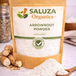 May include: A package of Saluza Organics arrowroot powder. The package is a light brown color with the words "Arrowroot Powder" and "Organic" printed on the front. A small pile of the white powder and a wooden spoon are in front of the package.