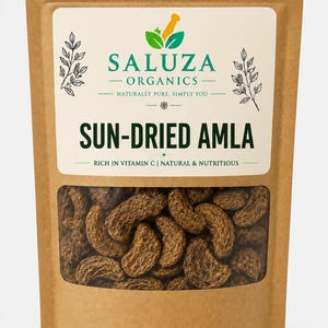 May include: A brown paper bag with a clear window showing sun-dried amla. The bag features a white label with the text "SALUZA ORGANICS" and "SUN-DRIED AMLA". The label also states the product is rich in Vitamin C and natural.