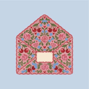 May include: A pink envelope decorated with roses, cherries, and blue flowers. The design includes a blank label and a red border with hearts. The background is a pale blue. The envelope is a decorative item.